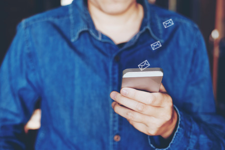 Businessman using mobile online icon social networking connection on screenの写真素材