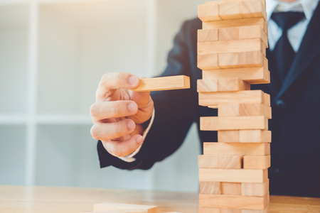 Businessman plan and strategy in business Domino Effect Problem Solvingの写真素材