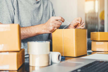 SME freelance man working with packaging startup entrepreneur small business owner at home,Online...