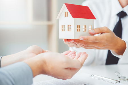 Sale agent giving house to customer and sign agreement contract, Insurance Home conceptの写真素材
