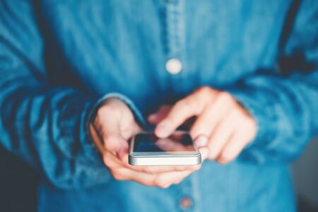 Man Typing Phone Message On Social Networkの写真素材