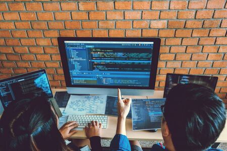 Developing programmer Team Development Website design and coding technologies working in software company officeの写真素材