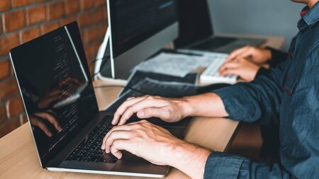 Developing programmer Team Development Website design and coding technologies working in software company officeの写真素材