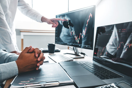 Business Team Investment Entrepreneur Trading discussing and analysis finance market graph stock...