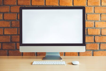 Workspace with Blank Computer Screen in cafeの写真素材