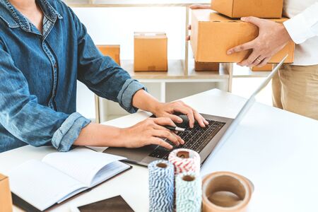 SME freelance team working with packaging startup entrepreneur small business owner at home,Online business seller packaging and delivery conceptの写真素材