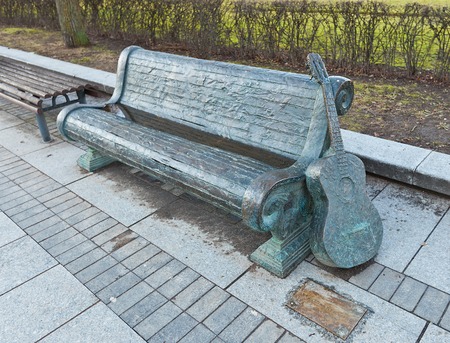 Memorial  bench and guitar  for Vytautas Kernagis  1951-2008 , Lithuanian singer, songwriter, bard, actor, director, and television announcer  Lukiskiu square, Vilnius, Lithuaniaのeditorial素材