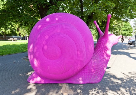 Riga, Latvia - May 25, 2014  Lilac snail on the street of Riga, Latvia  Artwork of Makslai Vajag Telpu organization installed to force the process of constructing a Museum of modern art in Rigaのeditorial素材