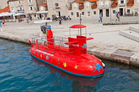 Trogir, Croatia - June 16, 2014  Red tourist semi-submarine at the waterfront of Trogir, Croatia  Semi-submarine provides sightseeing tours with undersea viewsのeditorial素材