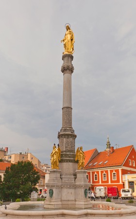 ZAGREB, CROATIA - JULY 21, 2014  Holy Mary column  circa 1865  with angels and fountain in front of Zagreb Cathedral, Croatia  Sculptor Dominik Fernkorn, architect Herman Bolleのeditorial素材