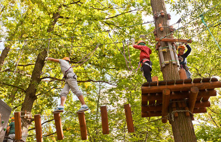 MOSCOW, RUSSIA - SEPTEMBER 06, 2014: Visitors of Adventure Panda-Park in Fili (Filyovsky) city park of Moscow, Russia. Treetop adventure park provides ropes courses for kids and adultsのeditorial素材