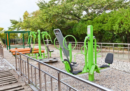 BUSAN, SOUTH KOREA - SEPTEMBER 25, 2014:  Exercise machines in Beomil-dong park of Busan, Republic of Korea. Many locals visit park every day to make training on different exercise machinesのeditorial素材