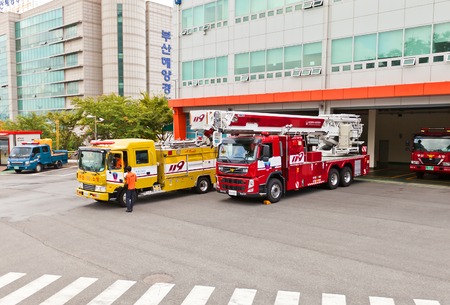 BUSAN, SOUTH KOREA - SEPTEMBER 26, 2014: Fire-fighting vehicles near fire-station in Busan town, Republic of Koreaのeditorial素材