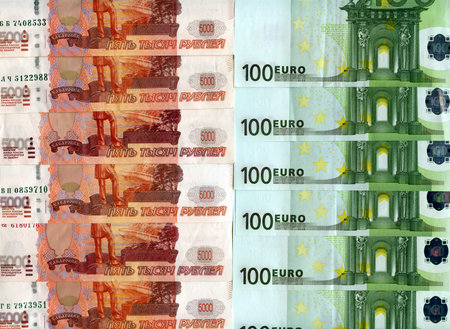 Background. 100 euro banknotes and 5 000 Russian rubles banknotes