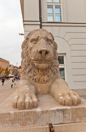 WARSAW, POLAND - OCTOBER 18, 2014: Sculpture of a lion (circa XIX c.) on Krakowskie Przedmiescie street in front of Presidential Palace in Warsaw, Polandのeditorial素材