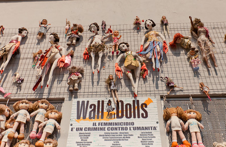 MILAN, ITALY - APRIL 11, 2015: Wall of Dolls art installation in Milan, Italy. A message from the Fashion World against violence on women. Dolls made by international fashion brands and designersのeditorial素材
