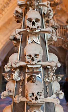 KUTNA HORA, CZECH REPUBLIC - NOVEMBER 04, 2015: Sculls and bones as part of lantern in Sedlec Ossuary (Kostnice v Sedlci, circa 1400). Chapel is one of the most visited tourist attractionsのeditorial素材