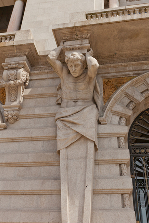 PORTO, PORTUGAL - MAY 26, 2016: Atlas sculpture on the facade of Municipality building (City Hall, early 20th c.) at Aliados Avenue in the center of Porto, Portugal. UNESCO siteのeditorial素材