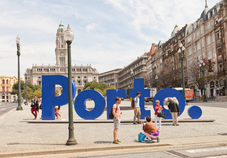 PORTO, PORTUGAL - MAY 26, 2016: Tourists near PORTO sign at Liberdade Square in the historical center of Porto, Portugal (UNESCO site)のeditorial素材