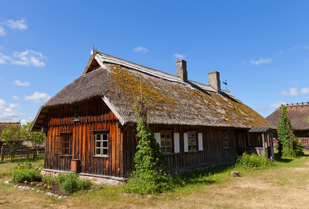 RIGA, LATVIA - JUNE 13, 2016: Dwelling house (circa 1880s) of Pape fishermen village of Kurzeme ethnic group. Exhibited in Ethnographic Open-Air Museum of Latvia since 1984のeditorial素材