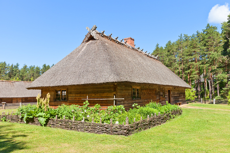 RIGA, LATVIA - JUNE 13, 2016: Dwelling rural house (circa 1848) of Veskerves farmstead of Kurzeme ethnic group. Exhibited in Ethnographic Open-Air Museum of Latvia since 2001のeditorial素材