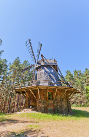 RIGA, LATVIA - JUNE 13, 2016: Dutch type windmill (circa 1890) of Pakalni village of Russian ethnic group. Exhibited in Ethnographic Open-Air Museum of Latvia since 1974のeditorial素材