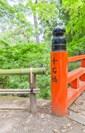 KYOTO, JAPAN - MAY 17, 2017: Pillar of Juichibashi Bridge in Fushimi Inari Taisha Shinto Shrine in Kyoto, Japan. Shrine was founded in 711 and is famous for red torii gate corridorsのeditorial素材