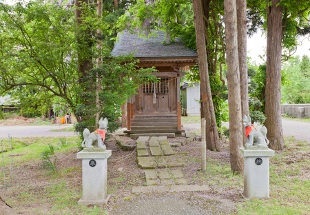 DAISEN, JAPAN - MAY 26, 2017: Small worship hall of Inari Shinto Shrine with kitsune fox guards. Located on the grounds of Naganobeyama Daisen Buddhist Temple in Daisen, Akita Prefecture, Japanのeditorial素材