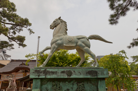 OKAZAKI JAPAN - MAY 31, 2017: Statue of a horse in Tatsuki Shinto Shrine of Okazaki Castle, Japan. Shrine is dedicated to deified shogun Tokugawa Ieyasu who was born in Okazaki castleのeditorial素材