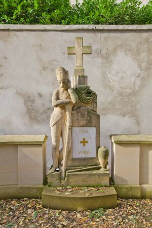 PRAGUE, CZECH REPUBLIC - NOVEMBER 4, 2017: Statue of a soldier in war memorial on Olsany Cemetery in Prague. Bones of soldiers were reburied here from Karlin districtのeditorial素材