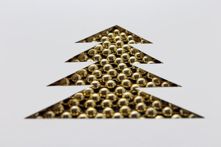 Christmas tree made of beads and paper. white stencilの写真素材