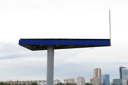 Billboard horizontal on the background of the city, cloudy sky.の写真素材