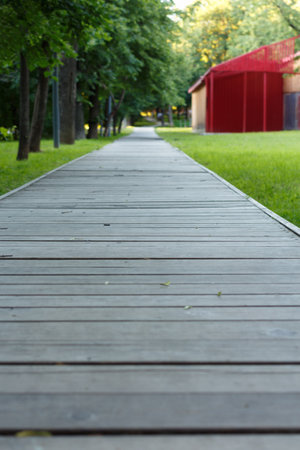 Wooden platform for walking in the park, blurred image.の写真素材