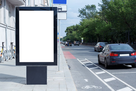 Vertical billboard for advertising and text in the city. Summer warm day. Mock up.の写真素材
