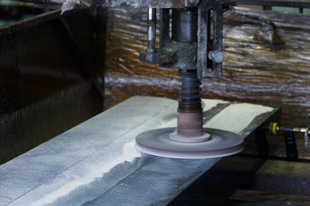 Industrial polishing of granite products, close-up.の写真素材