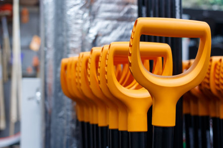 Multiple orange ergonomic hand tool grips, selective focus.の写真素材