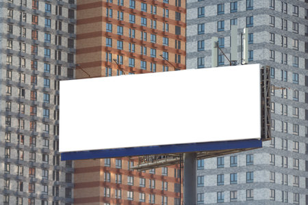 Horizontal large billboard against the background of a blurred image of residential apartment buildings.の写真素材