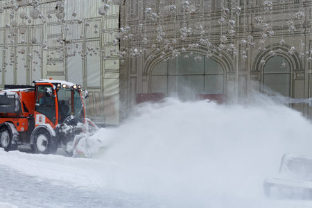 Mechanized snow removal in the city in winter. Moscow, Russia, February 13, 2021.のeditorial素材