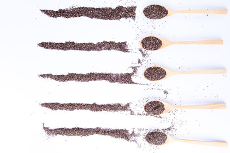 chia seeds on wooden spoon isolated on white background , top viewの写真素材