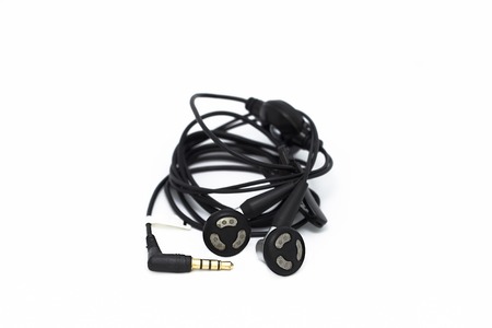 It is Black earphones isolated on white background.の写真素材