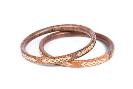 It is Two rattan bracelets isolated on white.