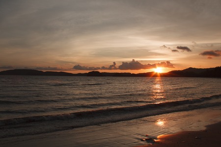 It is Sun sets over the mountain and sea.の写真素材