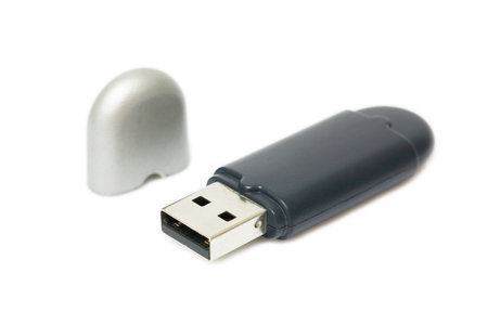 It is One external bluetooth usb with lid isolated on white.