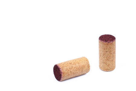 It is Two used wooden wine corks isolated on white.