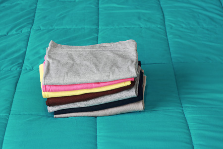 it is folding clothes on bed before keeping.の写真素材