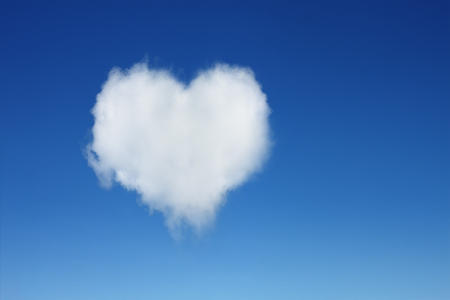 it is one heart shaped cloud on blue sky.の写真素材
