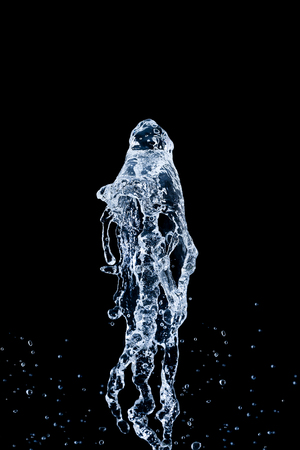 it is splashing water isolated on black.の写真素材