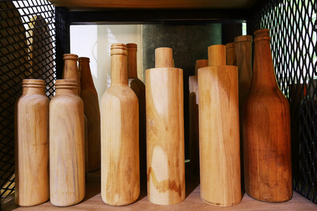 it is wooden bottles on shelf for pattern and design.の写真素材