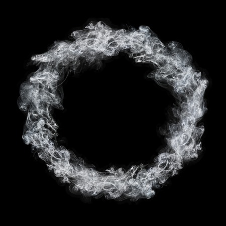 it is circle white smoke frame isolated on black.の写真素材