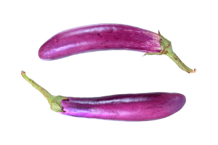 long purple eggplant isolated on whiteの写真素材